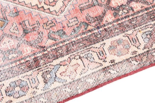 Backside of handmade 1950s Vintage rug showing knot structure and weave density