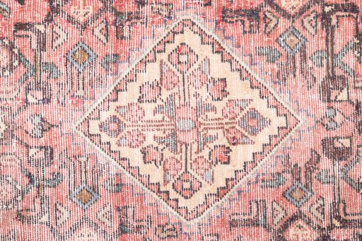 Close-up detail of 1950s Vintage rug from Iran / Persia showing Wool weave