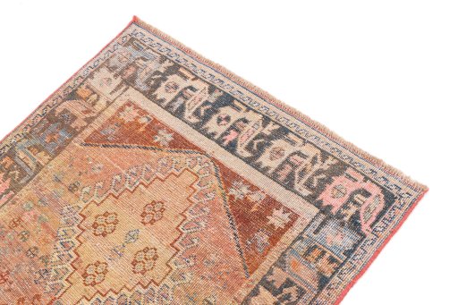 Surface texture of 1955s Vintage rug with natural Wool and intricate pattern