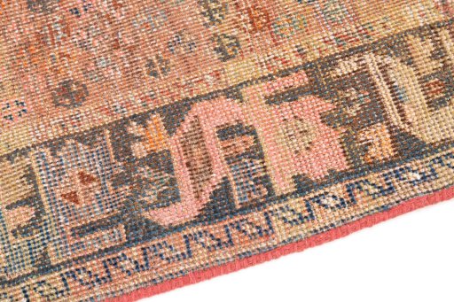 Backside of handmade 1955s Vintage rug showing knot structure and weave density