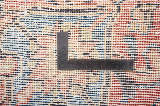 Surface texture of 1970s Vintage rug with natural Wool and intricate pattern