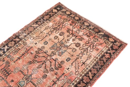Surface texture of 1950s Vintage rug with natural Wool and intricate pattern