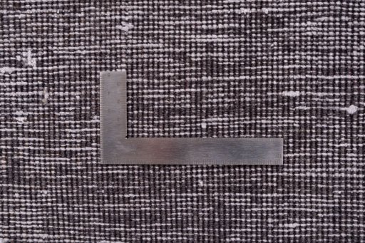 Corner detail of 1975s Vintage rug showing border pattern and Wool pile