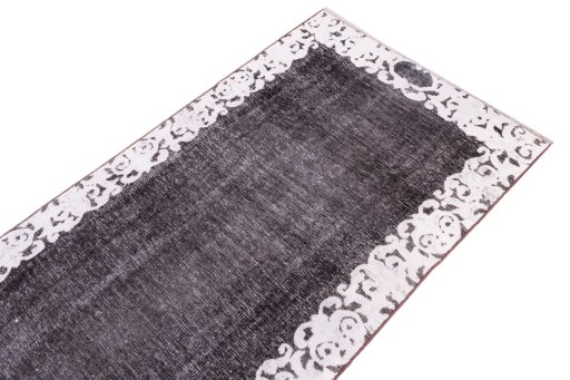 Surface texture of 1975s Vintage rug with natural Wool and intricate pattern