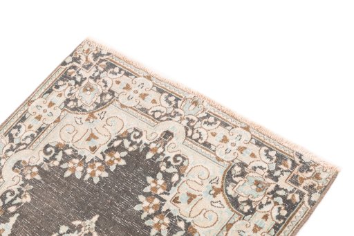 Surface texture of 1955s Vintage rug with natural Wool and intricate pattern