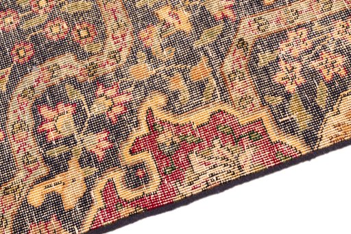 Backside of handmade 1945s Vintage rug showing knot structure and weave density
