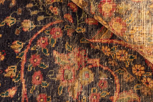 Corner detail of 1945s Vintage rug showing border pattern and Wool pile