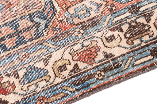 Backside of handmade 1940s Vintage rug showing knot structure and weave density