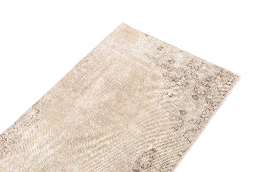 Surface texture of 1970s Vintage rug with natural Wool and intricate pattern