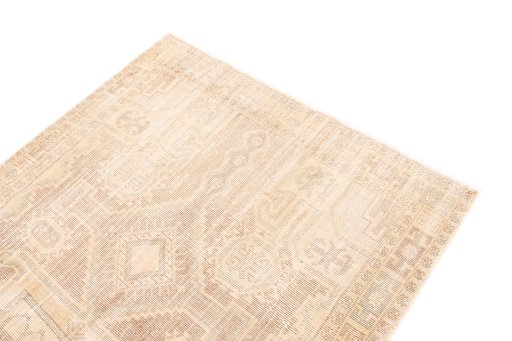 Surface texture of 1970s Vintage rug with natural Wool and intricate pattern