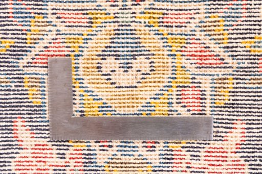 Corner detail of 1973s Vintage rug showing border pattern and Wool pile