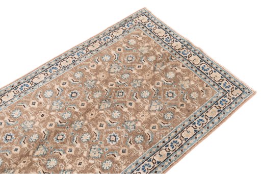 Surface texture of 1970s Vintage rug with natural Wool and intricate pattern