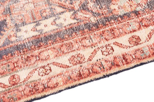 Backside of handmade 1970s Vintage rug showing knot structure and weave density