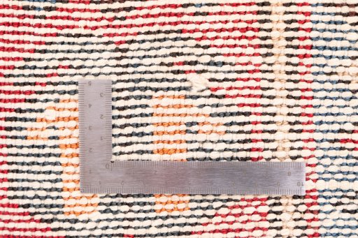 Corner detail of 1970s Vintage rug showing border pattern and Wool pile
