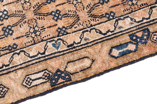 Backside of handmade 1970s Vintage rug showing knot structure and weave density