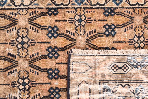 Close-up detail of 1970s Vintage rug from Iran / Persia showing Wool weave