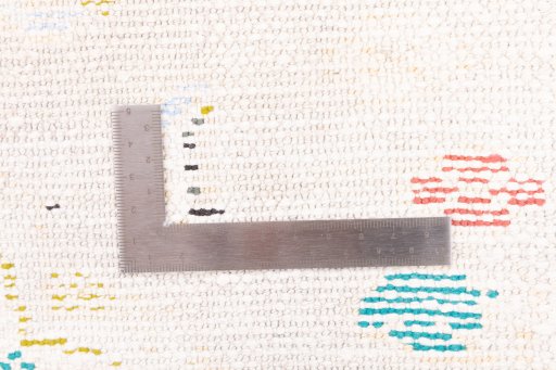 Corner detail of 1970s Vintage rug showing border pattern and Wool pile