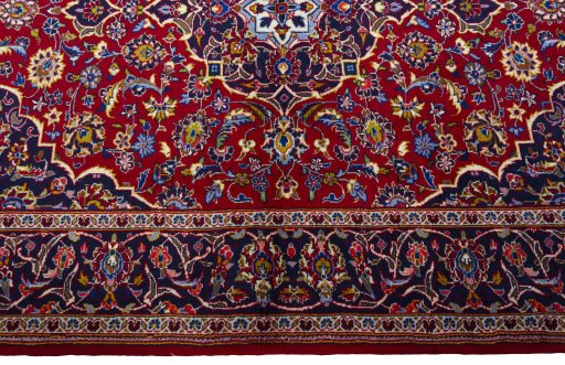 Full view of 2000s Kashan rug from Iran / Persia, 186 × 141 cm in Red tones
