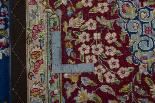 Backside of handmade 1970s Kerman rug showing knot structure and weave density