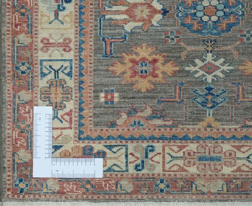 Corner detail of New Kazak rug showing border pattern and Wool pile