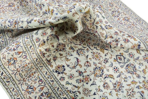 Surface texture of 2000s Kashan rug with natural Wool and intricate pattern