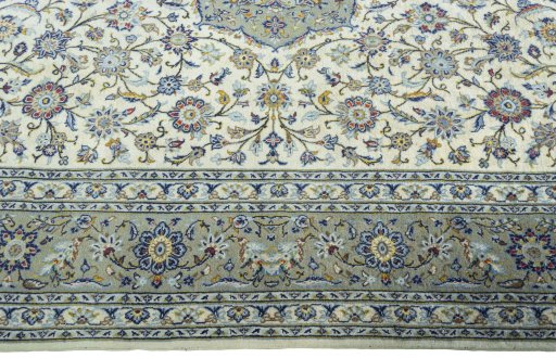 Corner detail of New Kashan rug showing border pattern and Cork pile