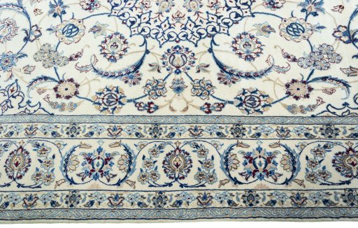Corner detail of New Nain rug showing border pattern and Wool pile