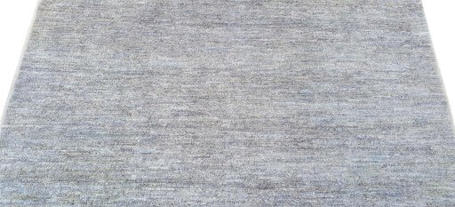 Backside of handmade New Morocco rug showing knot structure and weave density