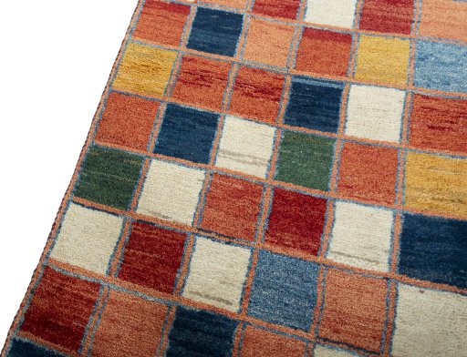 Backside of handmade 2000s Persian Gabbeh rug showing knot structure and weave density