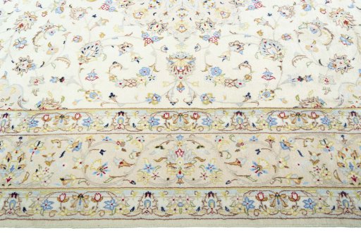 Corner detail of New Kashan rug showing border pattern and Wool pile