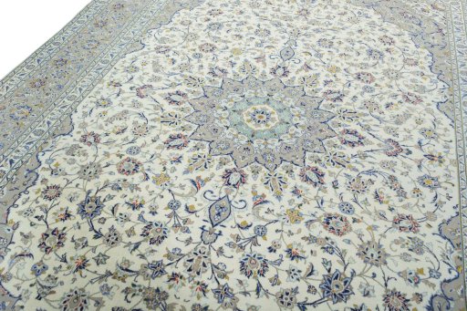 Backside of handmade 2000s Kashan rug showing knot structure and weave density