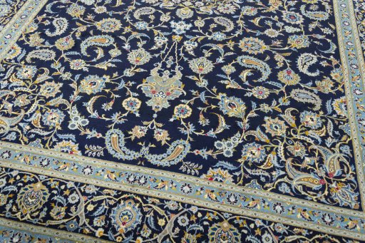Close-up detail of 2000s Kashan rug from Iran / Persia showing Wool weave