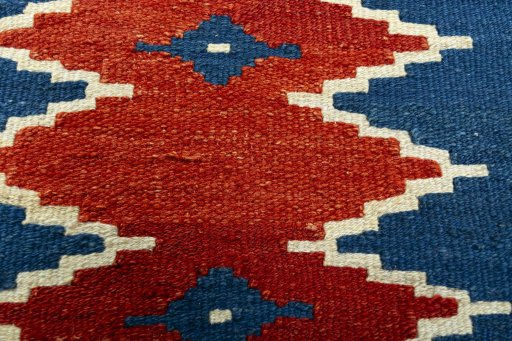 Backside of handmade New Modern Design rug showing knot structure and weave density