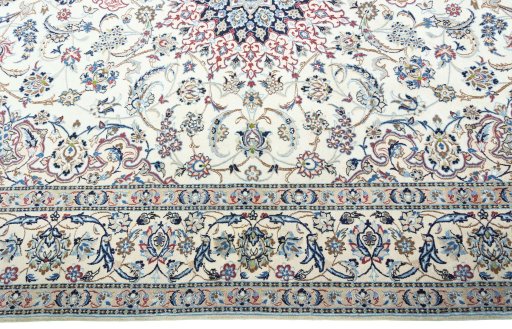 Corner detail of 2000s Nain rug showing border pattern and Wool pile