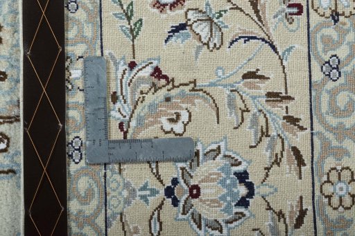 Backside of handmade 2000s Nain rug showing knot structure and weave density
