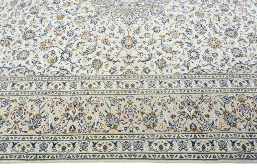Corner detail of 2000s Kashan rug showing border pattern and Wool pile