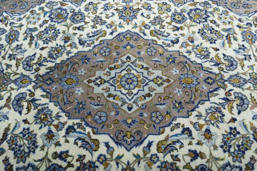 Central medallion detail of 2000s Kashan rug from Iran / Persia