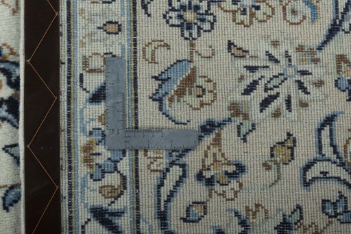 Backside of handmade 2000s Kashan rug showing knot structure and weave density