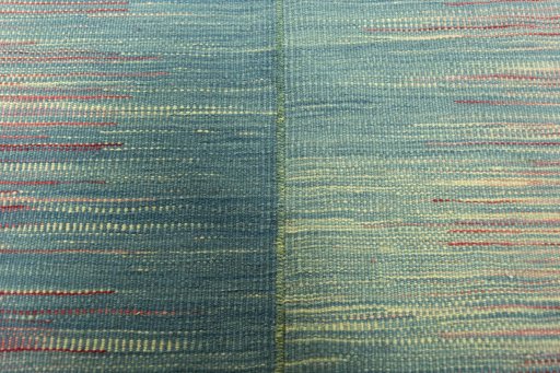 Backside of handmade New Kilim Kiasar rug showing knot structure and weave density