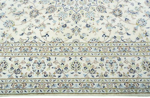 Corner detail of New Kashan rug showing border pattern and Wool pile