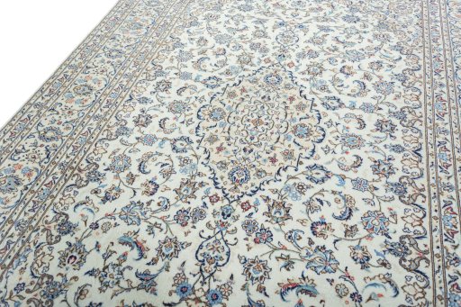 Backside of handmade 2000s Kashan rug showing knot structure and weave density