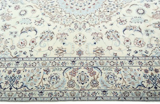 Corner detail of 2000s Nain rug showing border pattern and Wool pile