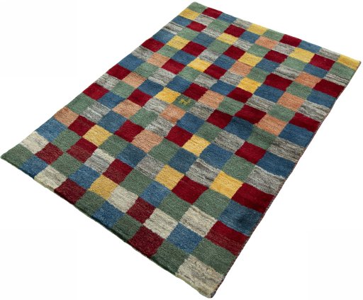 Corner detail of 2000s Persian Gabbeh rug showing border pattern and Wool pile