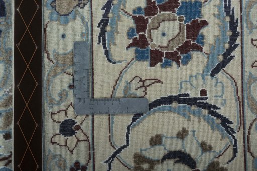 Backside of handmade 2000s Nain rug showing knot structure and weave density