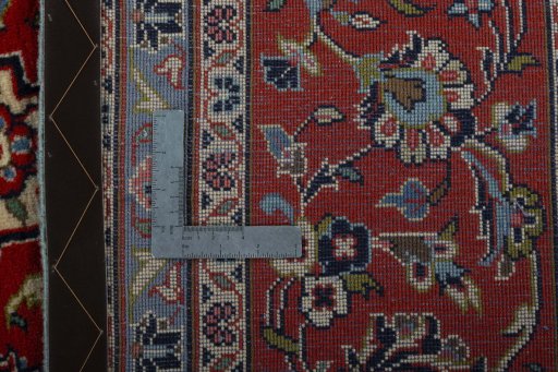 Backside of handmade New Kashan rug showing knot structure and weave density
