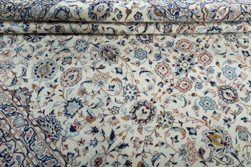 Close-up detail of 2000s Kashan rug from Iran / Persia showing Wool weave