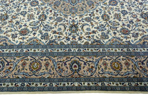 Corner detail of 2000s Kashan rug showing border pattern and Wool pile