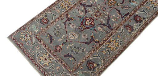 Backside of handmade New Farahan rug showing knot structure and weave density
