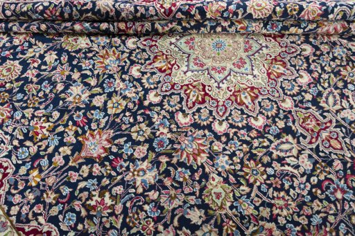 Close-up detail of 1970s Kerman rug from Iran / Persia showing Wool weave