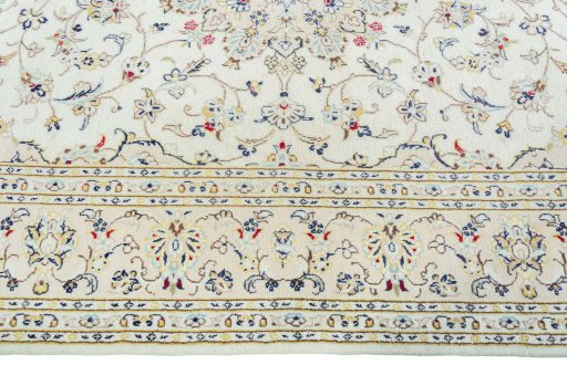 Corner detail of 2000s Kashan rug showing border pattern and Wool pile